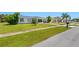 House exterior showcasing street appeal and neighborhood at 6064 Deming Ave, North Port, FL 34287