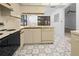 Kitchen with ample counter space and adjacent dining area at 104 Park Forest Blvd, Englewood, FL 34223