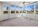 Bright screened porch with white framed windows at 104 Park Forest Blvd, Englewood, FL 34223