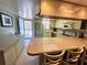 Kitchen with breakfast bar and stainless steel appliances at 179 Boundary Blvd # 7, Rotonda West, FL 33947