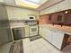 Bright kitchen featuring modern appliances and breakfast bar at 179 Boundary Blvd # 7, Rotonda West, FL 33947
