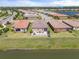 Aerial view of houses near a lake at 20450 Revival Ln, Venice, FL 34293