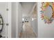 Bright hallway with light wood floors and decor at 20450 Revival Ln, Venice, FL 34293