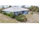 Single-story home with tile roof and landscaped yard at 1019 Schooner Ln, Englewood, FL 34224