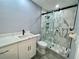 Clean bathroom with a large walk-in shower and white vanity at 1019 Schooner Ln, Englewood, FL 34224