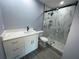 Modern bathroom with white quartz vanity and marble shower at 1019 Schooner Ln, Englewood, FL 34224