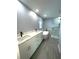 Bathroom with double vanity, soaking tub, and shower at 1019 Schooner Ln, Englewood, FL 34224