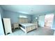 Main bedroom with ensuite bathroom and large bed at 1019 Schooner Ln, Englewood, FL 34224