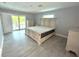Spacious main bedroom with large bed and patio access at 1019 Schooner Ln, Englewood, FL 34224