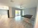 Dining area with access to pool and view of backyard at 1019 Schooner Ln, Englewood, FL 34224