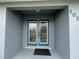 Front entrance with double doors and etched glass panels at 1019 Schooner Ln, Englewood, FL 34224