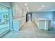 Spacious kitchen with white cabinets and large island at 1019 Schooner Ln, Englewood, FL 34224