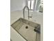 Modern kitchen sink with stainless steel basin and sleek faucet at 1019 Schooner Ln, Englewood, FL 34224