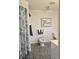Bright bathroom featuring a bidet and a beach-themed picture enhancing the room's decor at 15001 Appleton Blvd, Port Charlotte, FL 33981