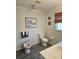 Bright bathroom featuring a bidet and a beach-themed picture enhancing the room's decor at 15001 Appleton Blvd, Port Charlotte, FL 33981