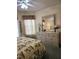 Bedroom featuring a dresser with mirror and tropical themed bedding at 15001 Appleton Blvd, Port Charlotte, FL 33981
