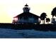 Exterior view of building on beach with elevated porch and view of ocean at 15001 Appleton Blvd, Port Charlotte, FL 33981