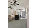 Welcoming living room with vaulted ceiling, comfortable seating, decor shelves, and an inviting entryway at 15001 Appleton Blvd, Port Charlotte, FL 33981