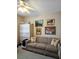 Comfortable living room with sofa, pillows, file cabinet, and artwork at 15001 Appleton Blvd, Port Charlotte, FL 33981