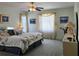 Spacious main bedroom showcasing natural light from the windows and a tranquil ambiance at 15001 Appleton Blvd, Port Charlotte, FL 33981