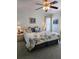 Serene main bedroom featuring a king-size bed, soft lighting, and neutral decor, offering a peaceful retreat at 15001 Appleton Blvd, Port Charlotte, FL 33981