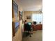 This home office space has multiple framed pictures and a ceiling fan at 15001 Appleton Blvd, Port Charlotte, FL 33981