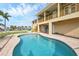 Inviting kidney-shaped pool with patio at 1921 Michigan Ave, Englewood, FL 34224