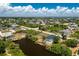 An aerial view of a residential neighborhood with waterfront properties at 9660 Miami Cir, Port Charlotte, FL 33981