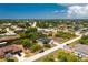 Aerial view of canal front property with a house and surrounding neighborhood at 9660 Miami Cir, Port Charlotte, FL 33981