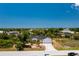 Aerial view of a single-Gathering home with a large backyard and a two-car garage at 9660 Miami Cir, Port Charlotte, FL 33981