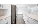 Modern kitchen with stainless steel appliances and white cabinets at 147 Ingram Rd, Rotonda West, FL 33947