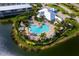 Aerial view of community pool and clubhouse at 10309 Coral Landings Ct # 101, Placida, FL 33946
