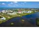 Aerial view of waterfront property, showcasing the building's location and surrounding landscape at 10309 Coral Landings Ct # 101, Placida, FL 33946