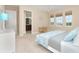 Bright bedroom with a view and en-suite bathroom access at 10309 Coral Landings Ct # 101, Placida, FL 33946
