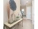 Bright entryway with decorative accents and glass-top console table at 10309 Coral Landings Ct # 101, Placida, FL 33946