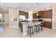 Modern kitchen with granite countertops, stainless steel appliances, and an island with seating at 10309 Coral Landings Ct # 101, Placida, FL 33946
