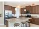 Modern kitchen with granite countertops, stainless steel appliances, and an island with seating at 10309 Coral Landings Ct # 101, Placida, FL 33946