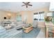 Bright and airy living room featuring comfortable seating and a dining area at 10309 Coral Landings Ct # 101, Placida, FL 33946
