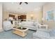 Open-concept living and kitchen area with ample natural light and stylish furnishings at 10309 Coral Landings Ct # 101, Placida, FL 33946
