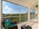 Spacious screened balcony with scenic water views at 10309 Coral Landings Ct # 101, Placida, FL 33946