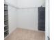 Spacious walk-in closet with shelving and hanging rods at 10309 Coral Landings Ct # 101, Placida, FL 33946