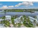 Luxury waterfront home with private dock, lush landscaping, and stunning water views at 13310 Anglers Way, Placida, FL 33946