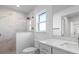 Modern bathroom with marble shower and white vanity at 256 Mariner Ln, Rotonda West, FL 33947