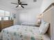 Bedroom with two twin beds, dresser, and ceiling fan at 256 Mariner Ln, Rotonda West, FL 33947