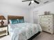 Bright bedroom with a queen bed and built-in dresser at 256 Mariner Ln, Rotonda West, FL 33947