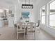 Bright dining room with white table and chairs at 256 Mariner Ln, Rotonda West, FL 33947