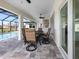 Outdoor patio with seating area and pool view at 256 Mariner Ln, Rotonda West, FL 33947