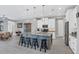 Modern kitchen with white cabinets, granite island, and stainless steel appliances at 10721 Ayear Rd, Port Charlotte, FL 33981