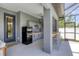 Outdoor kitchen with bar seating and modern appliances at 10721 Ayear Rd, Port Charlotte, FL 33981