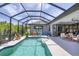 Spacious pool and patio area with screened enclosure at 10721 Ayear Rd, Port Charlotte, FL 33981